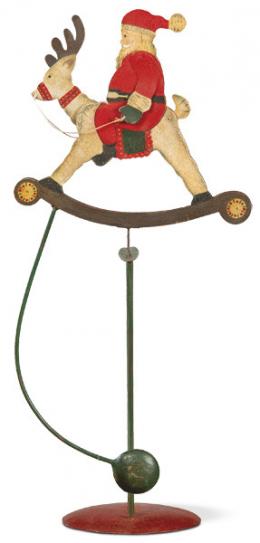Lote 1546: Tentieso Papa Noel en su reno en hierro pintado