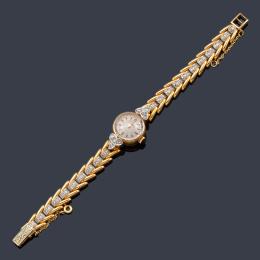 Lote 2089
OMEGA reloj joya años '40 de señora con caja y brazalete en oro amarillo de 18K, diamantes sobre vista en platino.