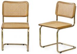Lote 1297: Marcel Breuer (1902-1981) Reedición
Pareja de sillas (B32) modelo Cesca. Con estructura tubular de metal dorado, asiento y respaldo de haya y paja de Viena trenzada.
Italia, S. XX