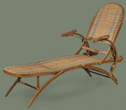 Lote 1025: Tumbona plegable, con respaldo regulable en madera de roble teñida, con asiento y respaldo de ratán trenzado.
Francia, mediados S. XX