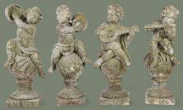 Lote 1042: Cuatro figuras de niños músicos en arenisca para jardín.