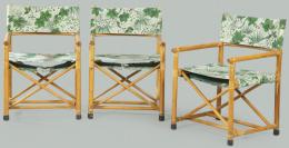 Lote 1267: Conjunto de seis sillones en madera de bambú con respaldo y asiento de tela con estampado de hojas.
S. XX