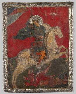 Lote 1099: Escuela Rusa ff. S. XIX
"San Jorge y el Dragón"
Icono pintado sobre tabla con aplicaciones en plata repujada.