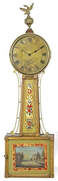 Lote 1085
Reloj de pared "Banjo Clock" firmado en la esfera L. Gales, Charlestown. Estados Unidos, mediados S. XIX