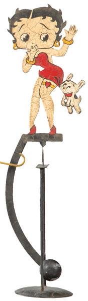 Lote 1539: Tentetieso "Betty Boop y Perro" en hierro pintado.