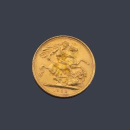 Lote 2611
Moneda Isabel II, libra en oro de 22 K.