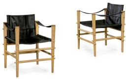 Lote 1262
Pareja de sillas Safari con estructura en madera de bambú y tapicería en cuero negro.
