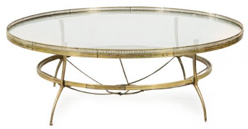  Mesa de centro redonda con estructura de latón y tapa de cristal.
Años 70