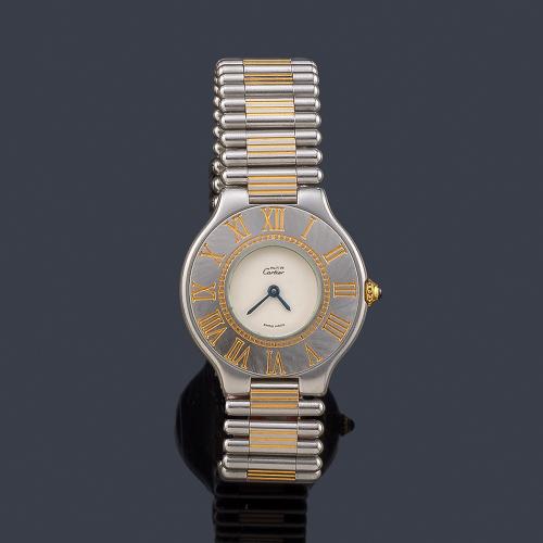 Lote 2639
CARTIER Must 21 de señora con caja y brazalete en acero y oro.