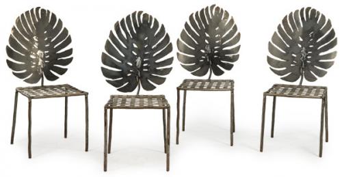  Fernando Oriol
Conjunto de cuatro sillas en acero, con respaldo en forma de hoja de "Adán" y asiento trenzado.