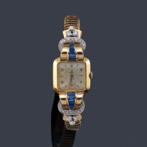  ROLEX reloj joya años '40 de señora con caja y brazalete en oro amarillo de 18K, diamantes y zafiros calibrados sintéticos.