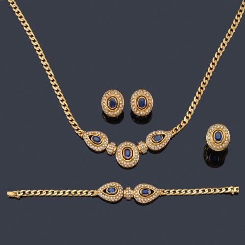  Conjunto con collar, pulsera, pendientes y anillo con zafiros talla  oval de aprox. 8,00 ct en total y brillantes, en montura de oro amarillo de 18K.
