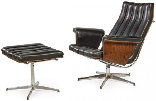 Lote 1307
Sillón con reposapiés realizado en madera contrachapada y doblada de palo de rosa, con tapicería de piel y estructura de acero cromado.