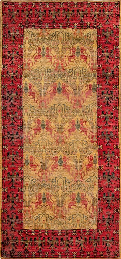  Alfombra española tipo Cuenca en lana.
Campo claro y cenefa roja con motivos geométricos y leones afrontados.