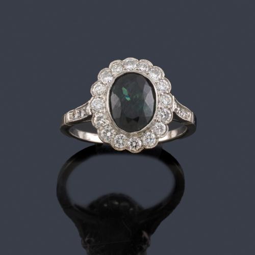  Anillo con zafiro talla oval de aprox. 1,91 ct y orla de brillantes de aprox. 0,63 ct en total.