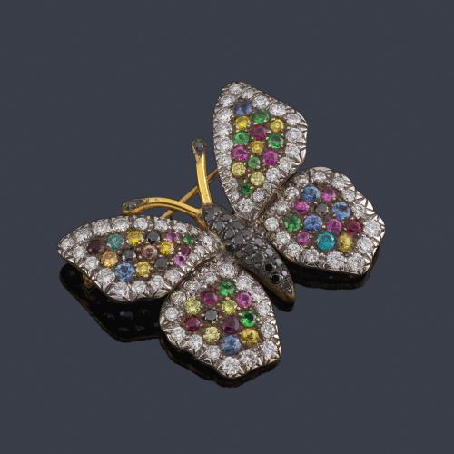 Lote 2245
LUIS GIL
Broche en forma de mariposa con brillantes negros, incoloros y fancy de diferentes colores y gemas de color.