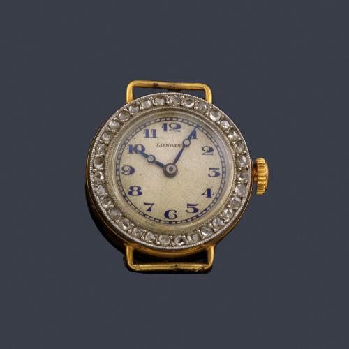  LONGINES de señora con caja en oro amarillo de 18 K con orla de diamantes.