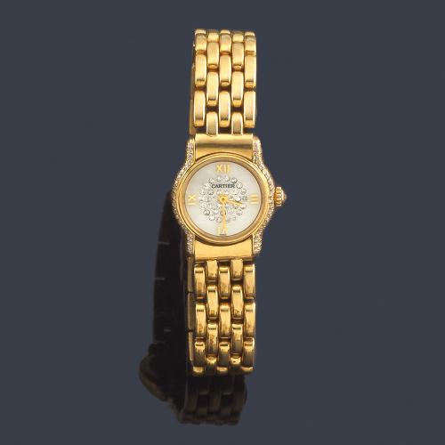Lote 2582
CARTIER de señora con caja y brazalete en oro amarillo de 18 K con brillantes.