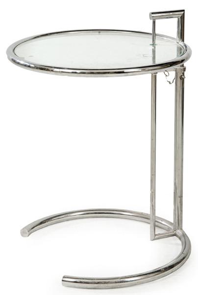 Lote 1337
Mesa auxiliar Eileen Gray E1027, regulable en altura, con estructura tubular de acero cromado y tapa de cristal.