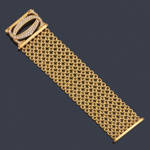 Lote 2313
CARTIER
Pulsera modelo 'Penélope' con eslabones circulares unidos entre sí realizados en oro amarillo de 18K. Año 2000.