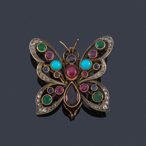 Lote 2096
Broche en forma de mariposa decorada con gemas de color, turquesas en cabujón y diamantes talla rosa.