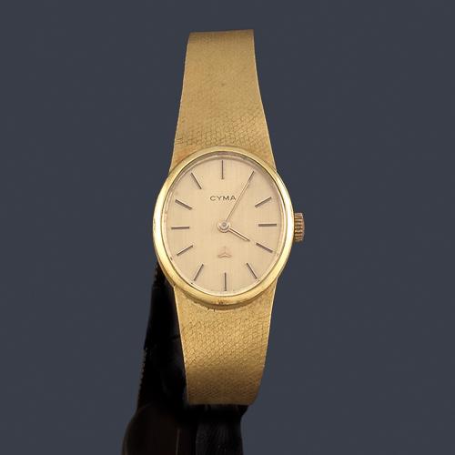  CYMA de señora con caja y brazalete en oro amarillo de 18 K.