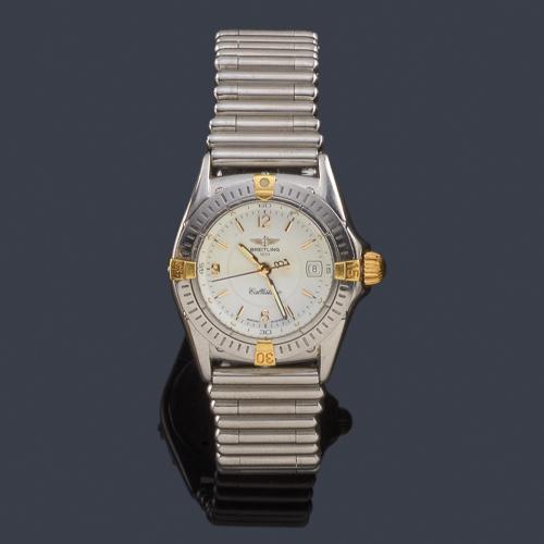 Lote 2568
BREITLING Callistino de señora con caja y brazalete en acero con almenas en oro.