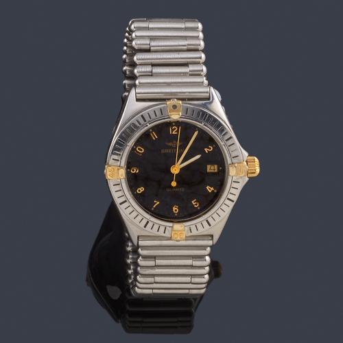 BREITLING modelo cadete con caja y brazalete en acero y almenas en oro.