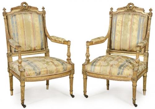 Pareja de butacas Napoleón III estilo Luis XVI en madera tallada y dorada, con tapicería de rayas y flores en seda amarilla.
Francia, segunda mitad S. XIX