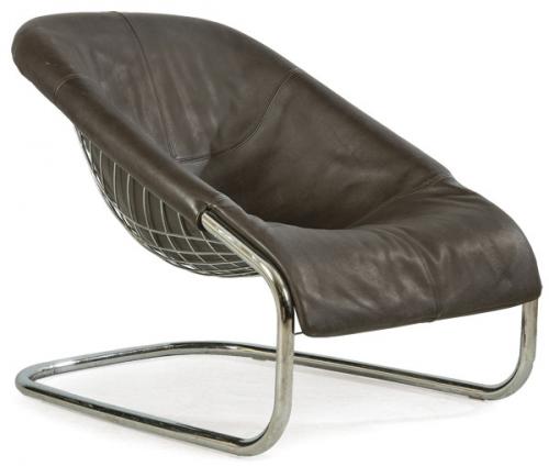  Gordon Guillaumier (1966) Minotti
Butaca modelo "Cortina" con estructura tubular en forma de canasta  varillas de metal cromado y tapicería en espuma de poliuretano de alta resiliencia con funda de cuero marrón. Con marca