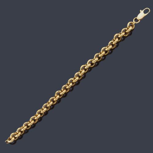  Pulsera con eslabones circulares en oro amarillo de 18K.