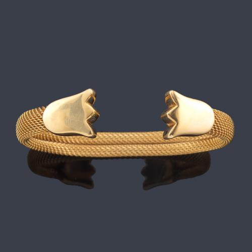  TOUS
Pulsera rígida con remate de dos tulipanes en oro amarillo de 18K.