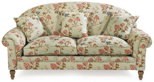  Sofá de dos plazas con estructura de madera y patas torneadas y tapicería de flores.
S. XX