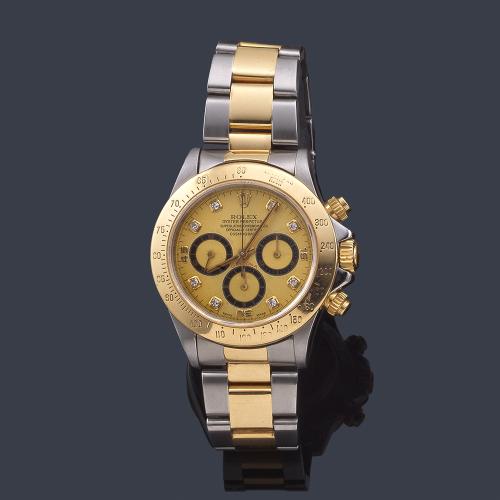 Lote 2678
ROLEX, Oyster Perpetual, Superlative Chronometer, Officially Certified, "Cosmograph Daytona" ref. 16523, de caballero con caja y brazalete en acero y oro de 18 K con numeración de brillantes.Con estuche.