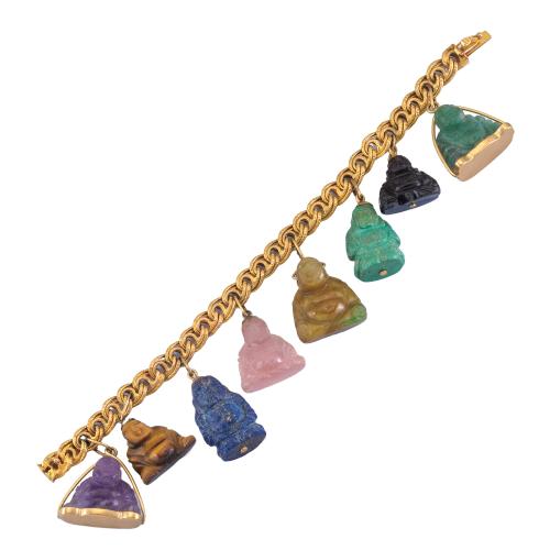 Lote 2291
Pulsera con ocho Budas realizados en lapislázuli, amatista, aventurina, ónix, cuarzo rosa y 'ojo de tigre' en montura y eslabones de oro amarillo de 18K.
