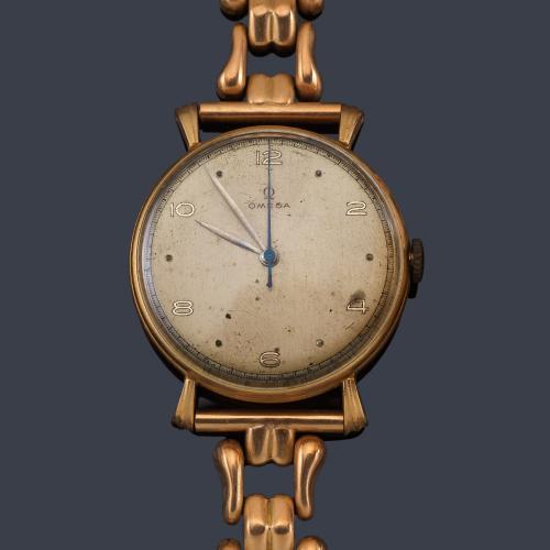 Lote 2547
OMEGA de caballero con caja y brazalete en oro rosa de 18 K.