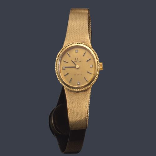  OMEGA de señora con caja y brazalete en oro amarillo de 18 K.