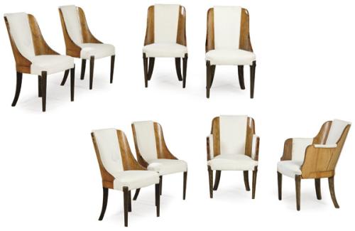  Conjunto de seis sillas y dos butacas art decó en madera de nogal, con tapicería de época posterior.Años 20