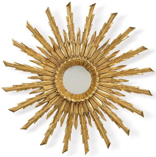  Espejo sol con rayos concéntricos en madera tallada y dorada.