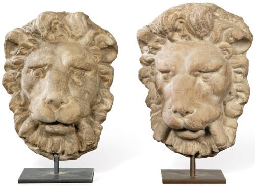 Pareja de máscaras de león de caliza para jardín.