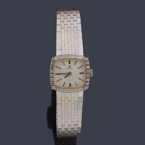 OMEGA De Ville de señora con caja y brazalete en oro blanco de 18 K con brillantes.