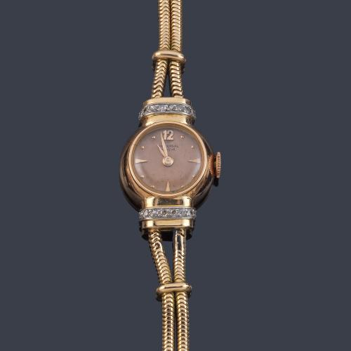 UNIVERSAL Geneve de señora con caja y brazalete en oro rosa de 18 K con diamantes.