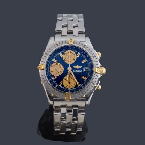 BREITLING Chronographe ref. B13352 de caballero con caja y brazalete en acero y almenas en oro.