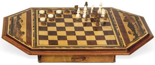  Caja tablero de ajedrez y backgamon con marquetería de casas en maderas exóticas, posiblemente de alguna colonia portuguesa S. XIX.