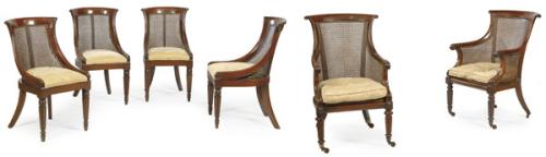  Conjunto de diez sillas y dos butacas victorianas en madera de caoba tallada, con respaldo de rejilla y asiento tapizado.