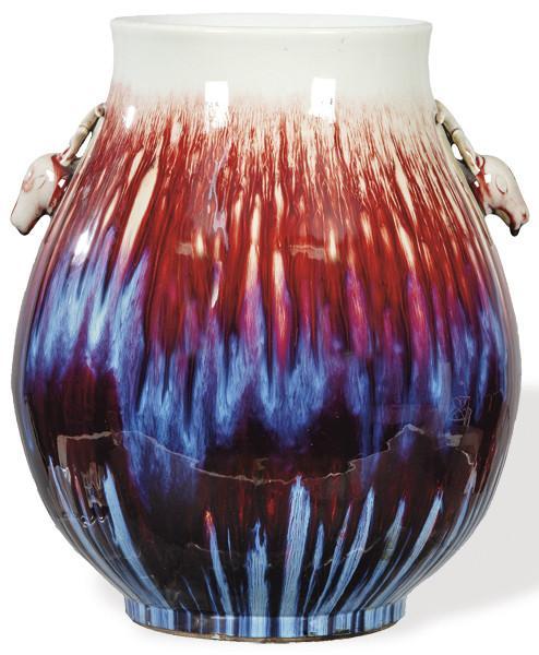  Gran jarrón de porcelana china sangre de toro flambeado y asas de cabeza de ciervo S. XX.
