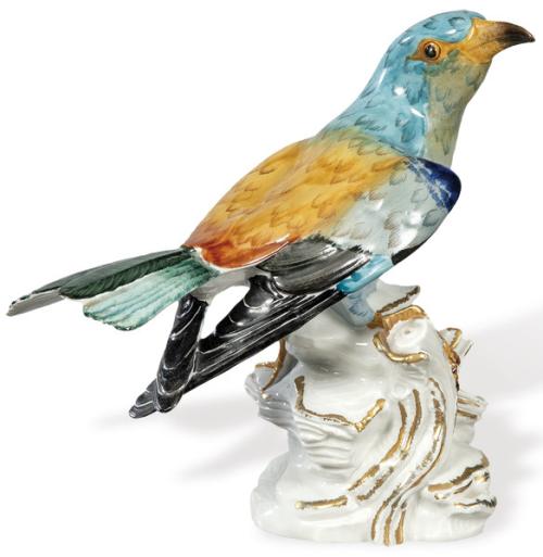 Figura de pájaro sobre rama de arbol en porcelana pintada y esmaltada de Artibus.