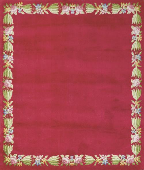 Alfombra española en lana con campo rojo bordeado por guirnalda floral.