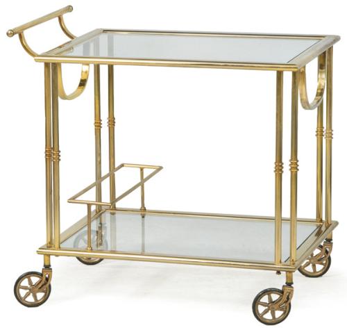Carro de servir con estructura tubular en latón, con dos baldas de cristal.