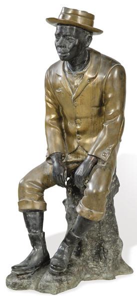 "Afroamericano Sentado" escultura de bronce dorado y patinado al estilo de los años 40-50.